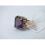 A square amethyst ring with diamond border (1 missing) in 18ct gold - size P - 8.1gms