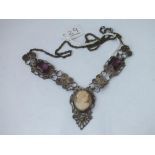 A silver filigree necklace with cameo & stone panels