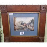 A VICTORIAN WATERCOLOUR. A RIVER AND VILLAGE WITH FIGURES IN A BOAT IN A CARVED OAK FRAME.