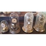 4 TORSION CLOCKS WITH GLASS DOMES