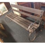 WROUGHT IRON BENCH WITH WOODEN SLATS