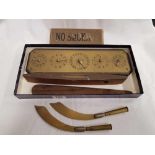 SMALL CARTON WITH BRASS SCORE BOARD, NO SMOKING SIGN, 2 TRENCH ART PIECES & BOAT SHAPED SPIRIT