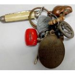 KEY RING WITH COINS, COPPER SKULL, MEDALLIONS & PENKNIFE