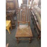 HEAVILY CARVED OAK GOTHIC STYLE DINING CHAIR WITH BARLEY TWIST FEATURES