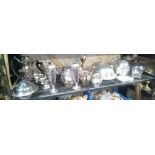 SHELF OF PLATEDWARE INCL: COFFEE POTS, TEA POTS, WATER JUGS, SUGAR BOWLS ETC