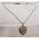A SILVER HEART SHAPED HINGED LOCKET ON SILVER CHAIN