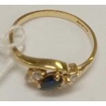 A SAPPHIRE & WHITE STONE RING SET IN 9ct