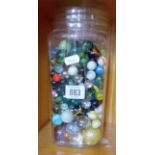 LARGE JAR OF GLASS MARBLES