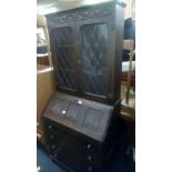 1970'S DARK OAK BUREAU BOOKCASE WITH LEADED GLASS DOORS