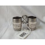 A pair of antique continental barrel-shaped small mugs