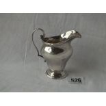 A helmet shaped cream jug with reeded and ribbon border - 3.5" high - B'ham 1922 - 83gms