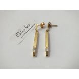 A pair of long ear pendants with white stone ends in 9ct - 3gms