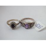 Two silver stone set rings