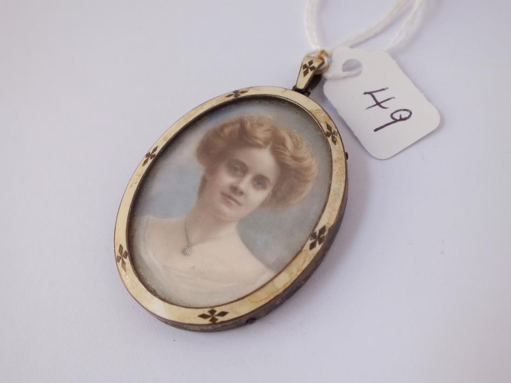 A silver & enamel miniature frame depicting a lady