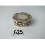 An embossed oval pill box with hinged cover - 1.75" wide - B'ham 1966 by HU