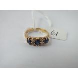 A 7 stone sapphire & diamond ring in 18ct gold - size N - 4.1gms