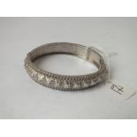 A Victorian silver bangle with heart edging - hallmarked 1882