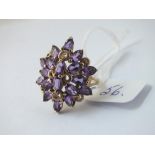 A large amethyst cluster ring in 9ct - size O - 6.1gms