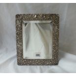 A dressing table mirror with embossed border - 10.5" high - B'ham 1901