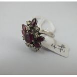 A CONTEMPRARY DIAMOND & RUBY RING SET IN 18CT WHITE GOLD - size M - 5.5gms