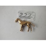 A 9ct charm in the form of a horse - 3.2gms