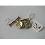 A pair of gold (unmarked) yellow/green stone cufflinks in 9ct - 8.3gms