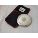 A circular compact with hinged cover and fitted interior - stamped Sterling - 2.5"DIA