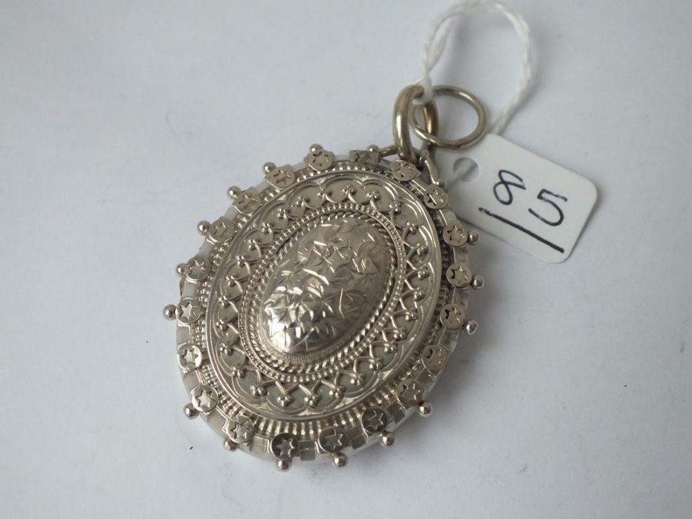 A large antique decorative silver hallmarked locket