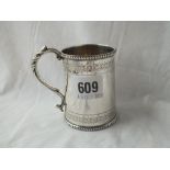 A Victorian christening mug with two bands of bright cut decoration - 3" high - 1861 by RH - 100gms