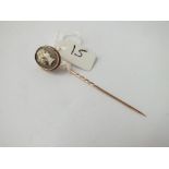 A cameo stick pin in 9ct