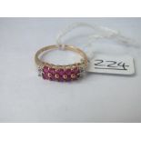 A diamond & pink stones in two rows marked DIA ring in 9ct - size P - 2.09gms