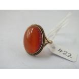 A large oval amber stone ring in 9ct - size M - 5.3gms