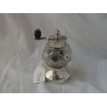 A pepper mill with cut glass body - probably London 1899
