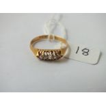 A five stone diamond ring in 18ct gold - size Q - 3gms