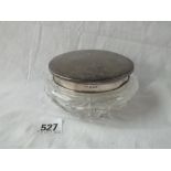 A powder jar with decorated top and glass body. 4.5"DIA. B'ham 1957