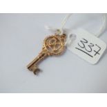 A charm in the form of an '18' key in 9ct - 2.1gms