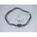 A amethyst line bracelet with concealed clasp in 9ct - 8.7gms