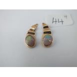 A pair of opal drop earrings in 9ct