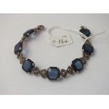 A silver & paste & blue glass panel bead bracelet