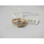 A white stone dress ring in 14ct gold - size J - 3.4gms