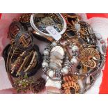 A large tin of 20 plus assorted items of costume jewellery