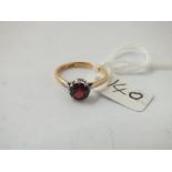 An antique single stone garnet ring in 18 ct gold & platinum - size N - 2.3gms