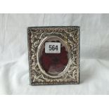 A photo frame with circular aperture - 4.5" high - London 1965