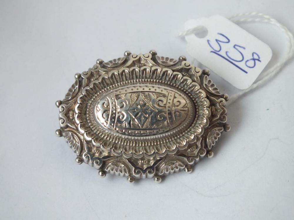 A vintage silver target brooch (unmarked)