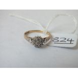 A diamond cluster ring set in 9ct - size M - 1.7gms