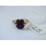 A dark stone ring in 9ct - size K