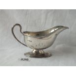 A Georgian-style sauce boat on an oval pedestal base - 6" wide - Sheffield 1906 by Martin HALL &