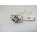 A BLUE TOPAZ & DIAMOND 3 STONE RING IN 18CT GOLD - size Q - 3.7gms