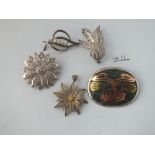 Five silver brooches