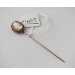 A cameo topped stick pin in 9ct